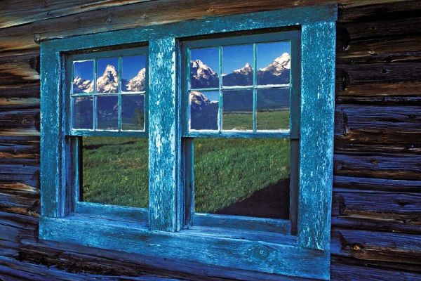 WY, Grand Tetons reflecting in windows at sunrise